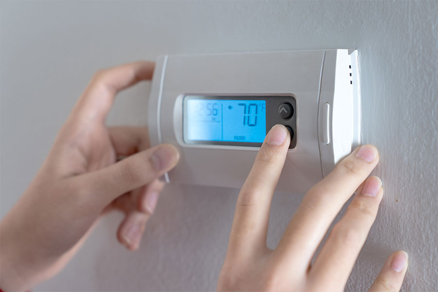 Smart thermostat installed on wall inside a home in Atlanta GA