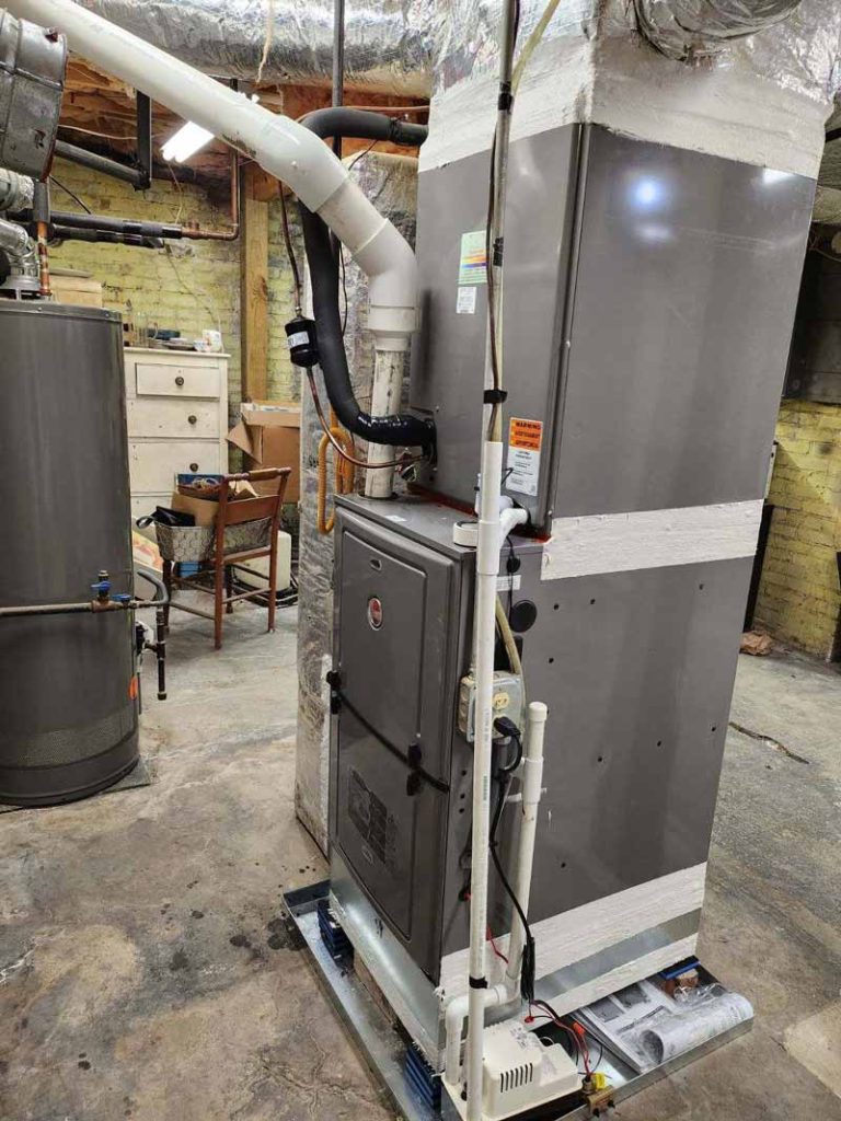 Installed furnace with ductwork and condensate pump by Hope Heating & Air